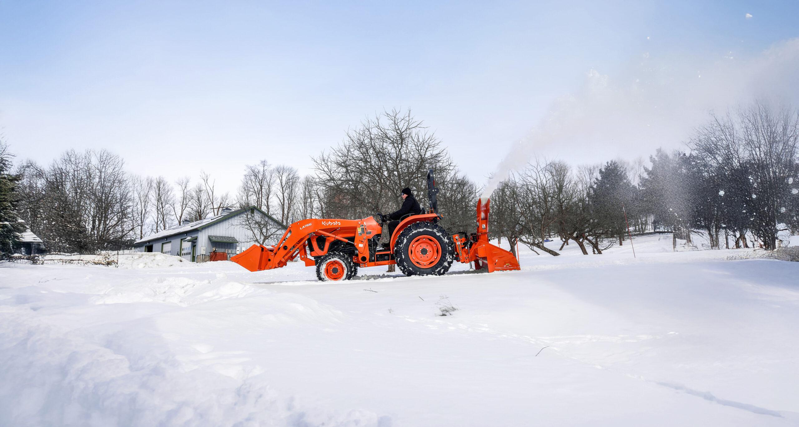 Kubota L Series Tractor Hauling Snow in the Winter